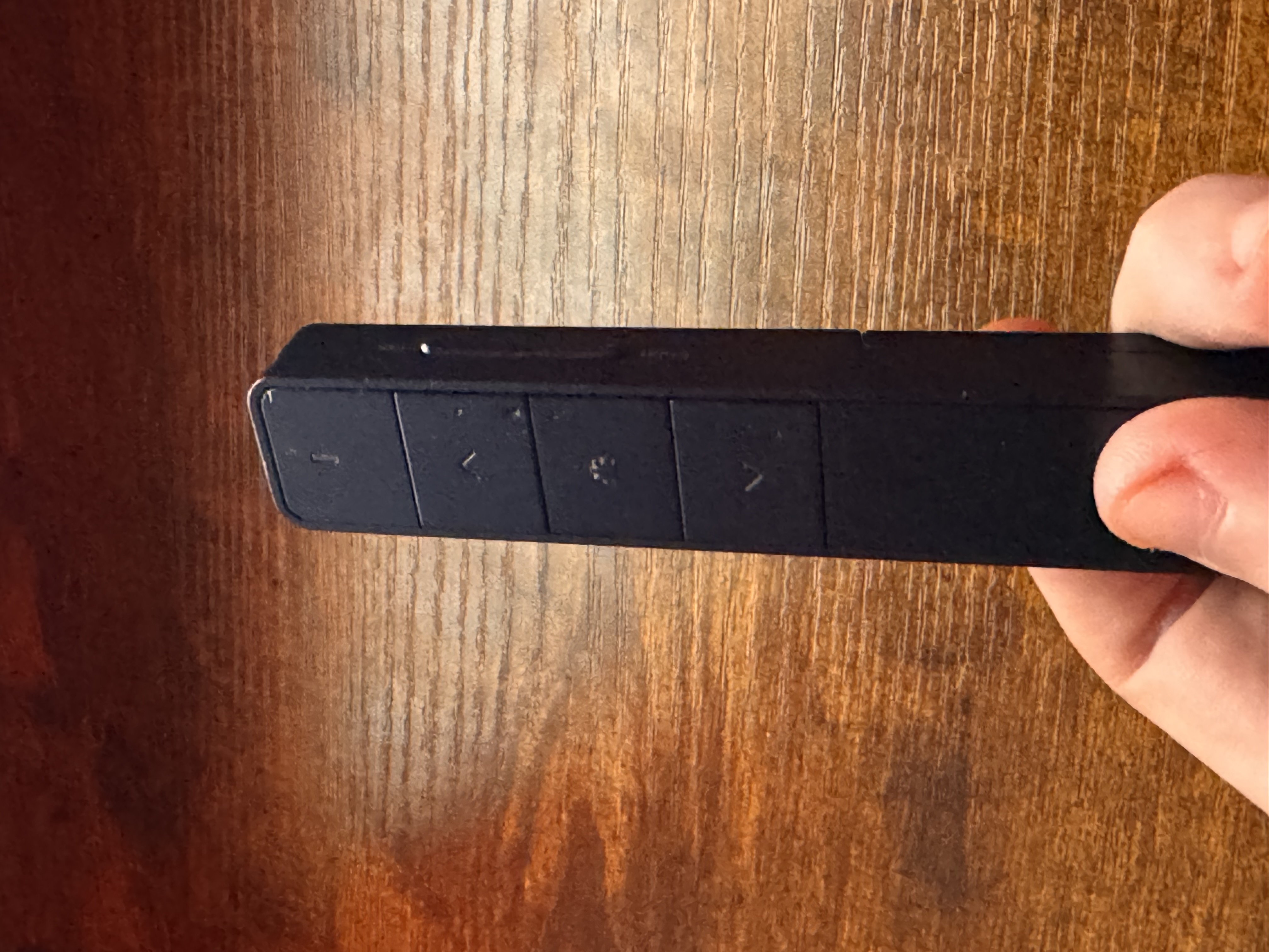 A reprogrammed presentation clicker for hands-free dictation.